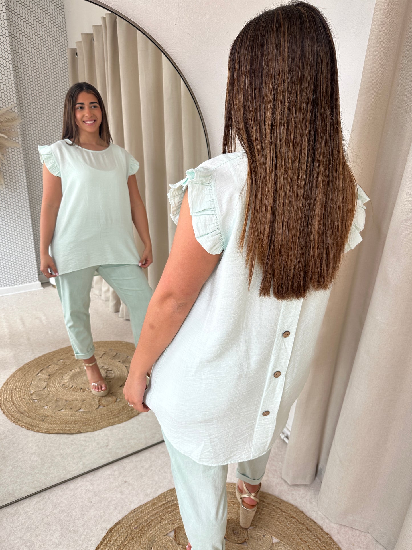 BUTTONED BACK