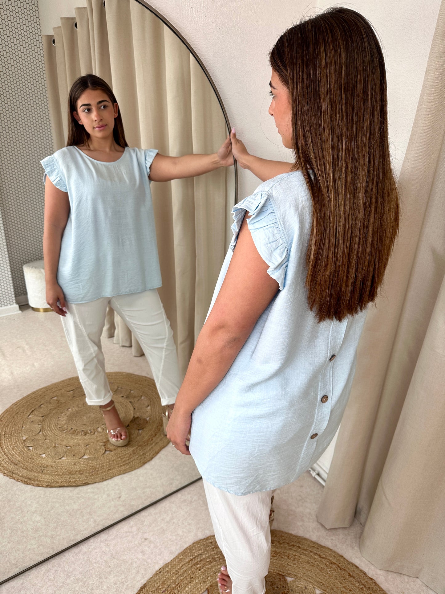 BUTTONED BACK